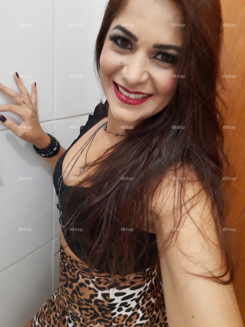 smiling and happy woman in animal print clothes