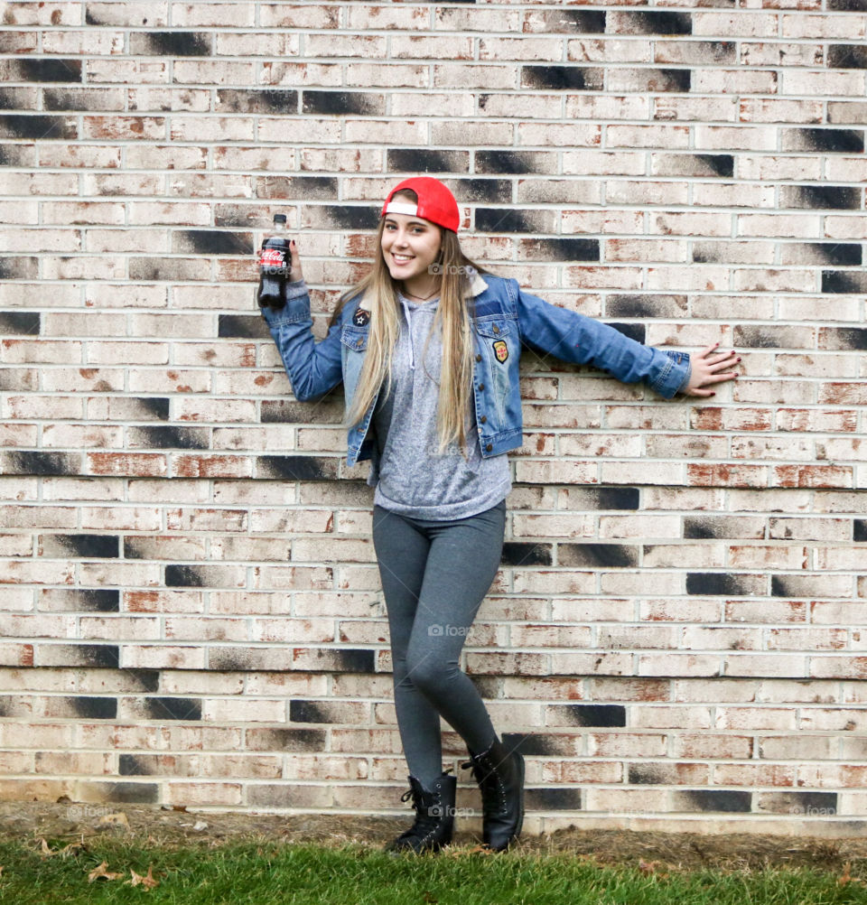 Coca’Cola - girl on brick wall with a coke.