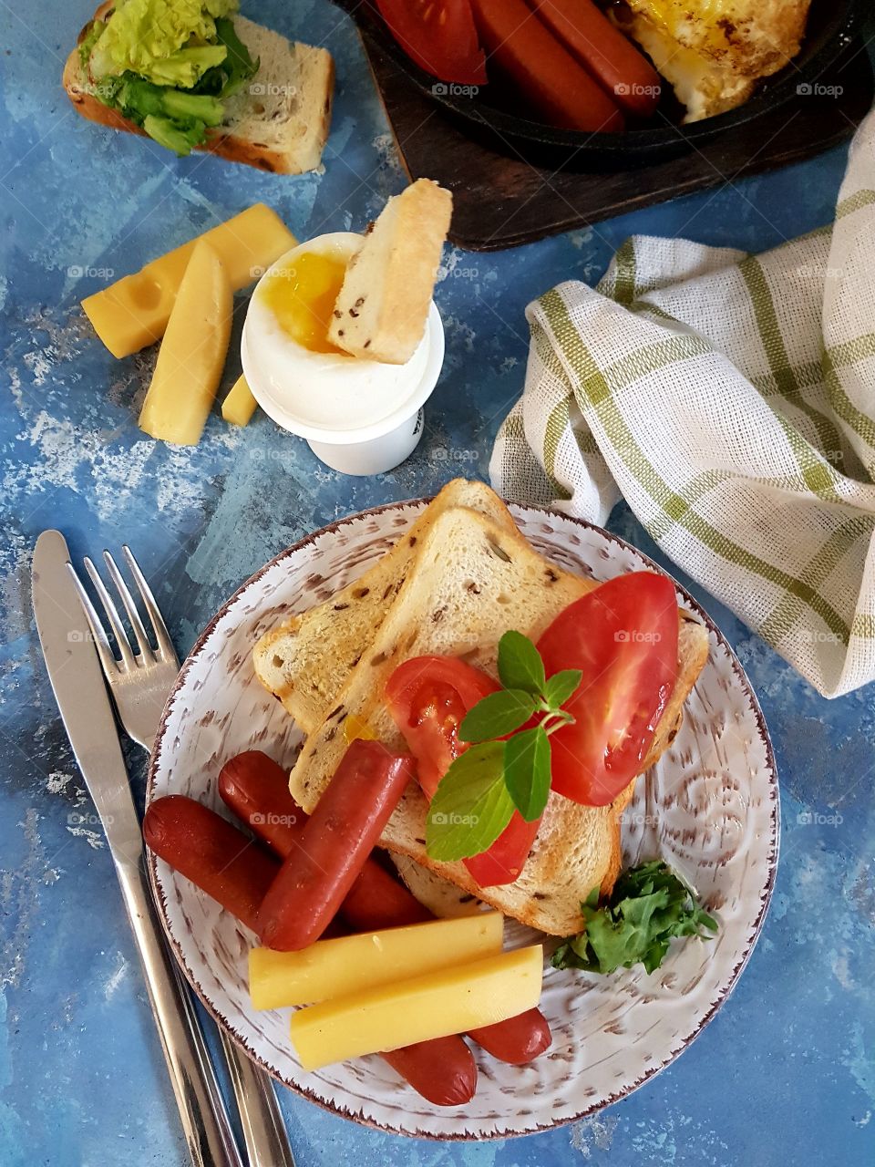 breakfast with egg, vegetables and sausage