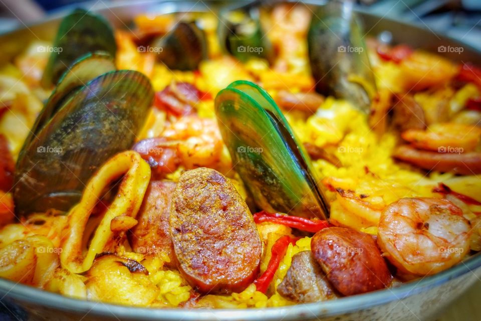 Spanish paella - a popular cuisine consisting of saffron rice, chorizo, vegetables and seafood.