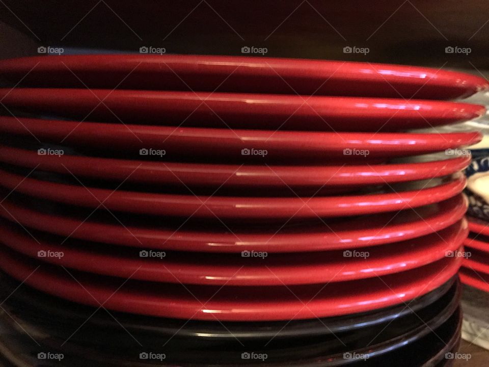 Red plates stacked