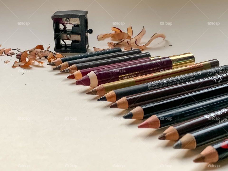 Assorted cosmetic pencils in various sizes and colours, all neatly sharpen