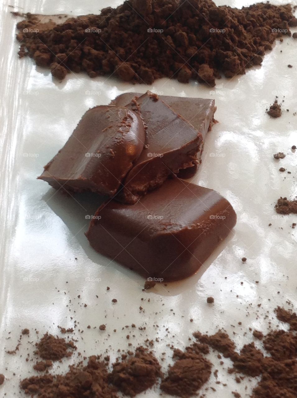 Pieces of fudge with cocoa powder.