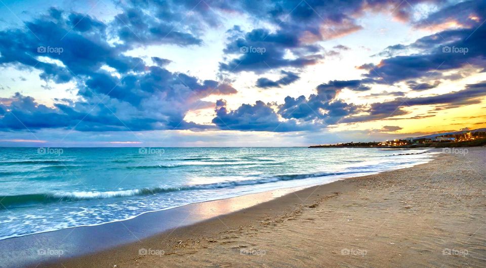 Seascape - A sandy beach and cloudy sky 