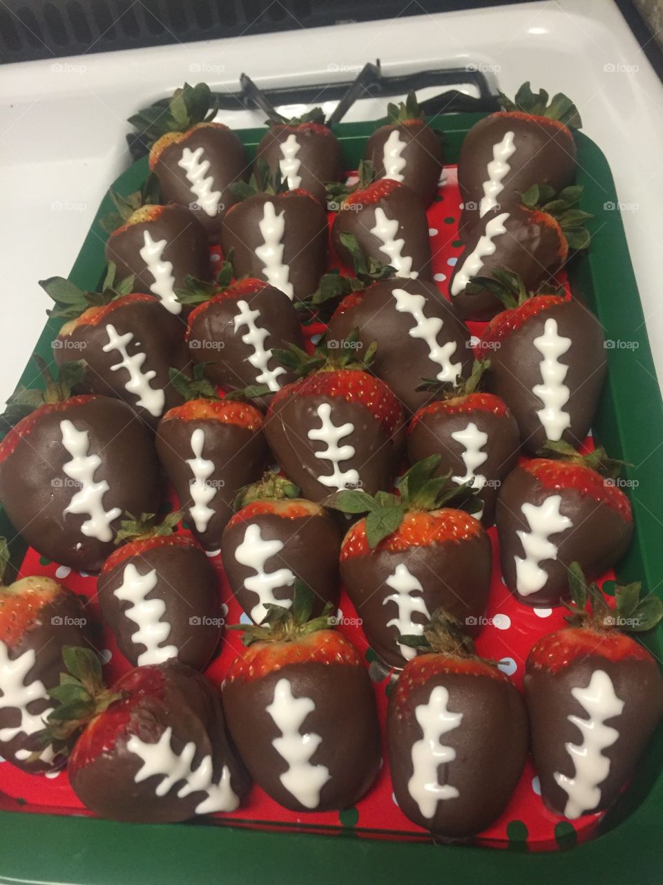 Chocolate covered strawberry footballs