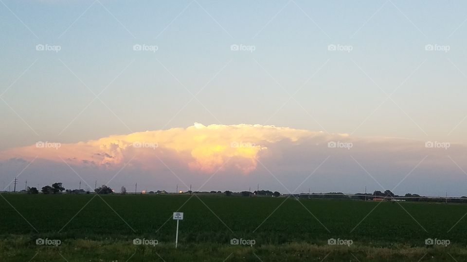 storm front with sunset