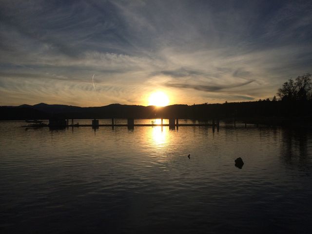 Reflection of sun on lake during sunset