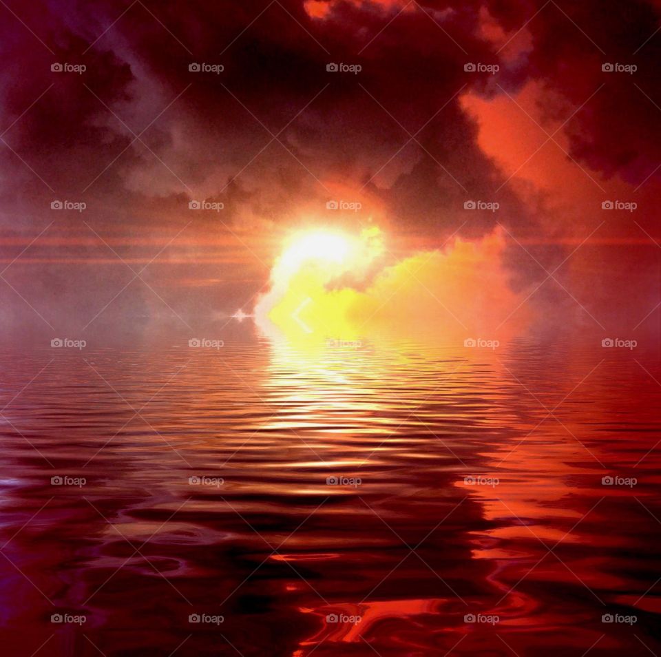 Blazing red sunset over water . Blazing red sunset over water