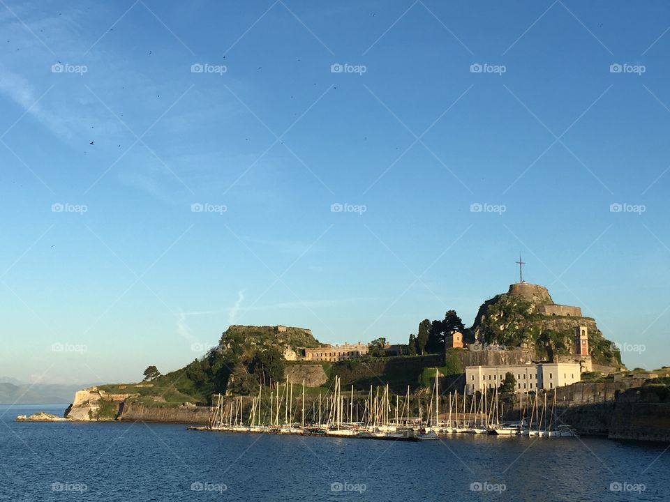 Swallows flying away from the Old Fortress in Corfu Town, Greece