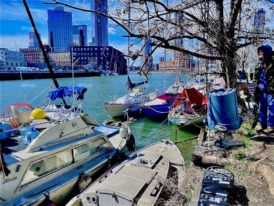 “Newtown Creek” by the “Pulaski Bridge” in LIC, Queens is clearly one of the best places to be in the city. Today the waves of the “East River” sparkle and the sunlight bounces off the ivory fiberglass of the boats. 2023. Hypnotic Productions