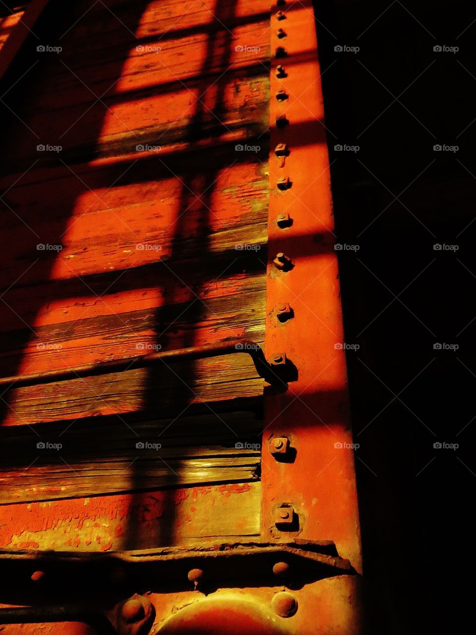 Shadows on an old train car 