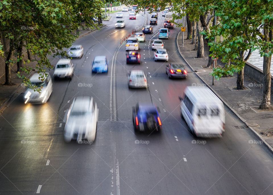 defocused traffic on a four lane city street at evening