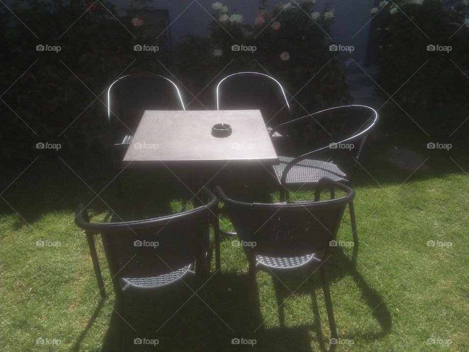 Beautiful seat with chairs in the garden.