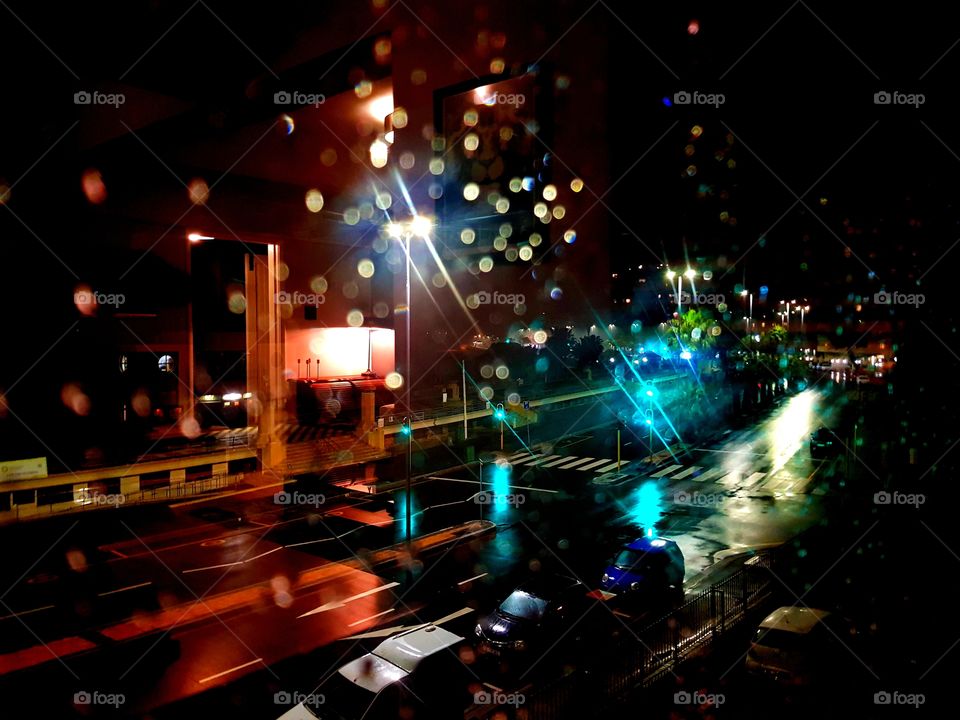 The scene reflected on and through the mirror after raining in the heart of Cape Town City, South Africa, during the night time showed the serenity of the big city!