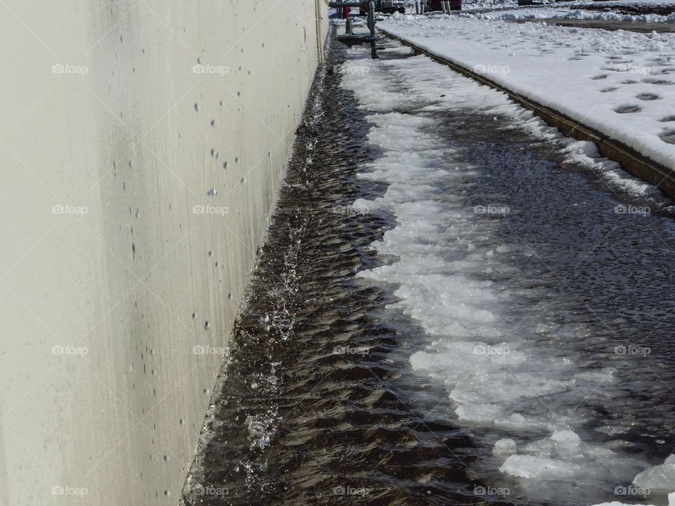 Melting snow off of a roof