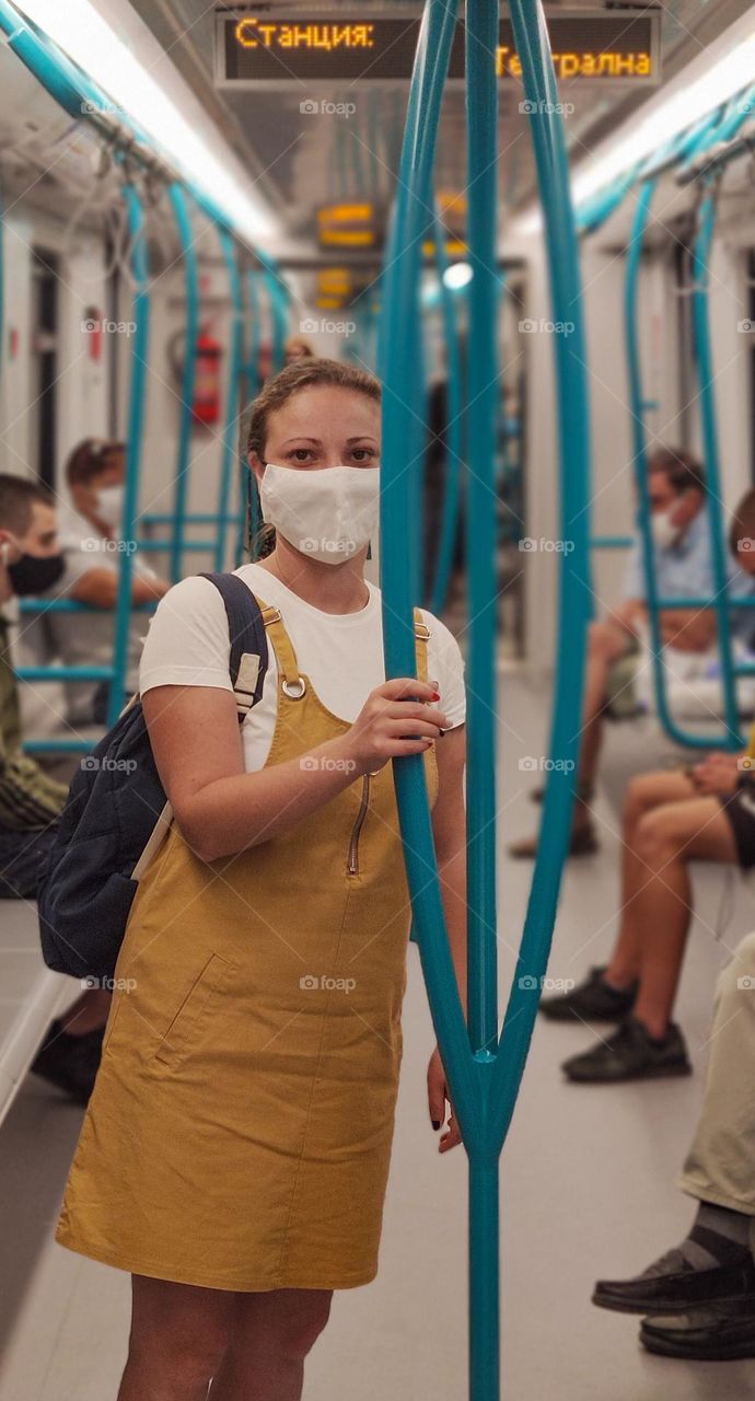 Commuting subway with masks on