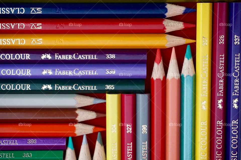 Faber-Castell colouring pencils in a three way pattern.