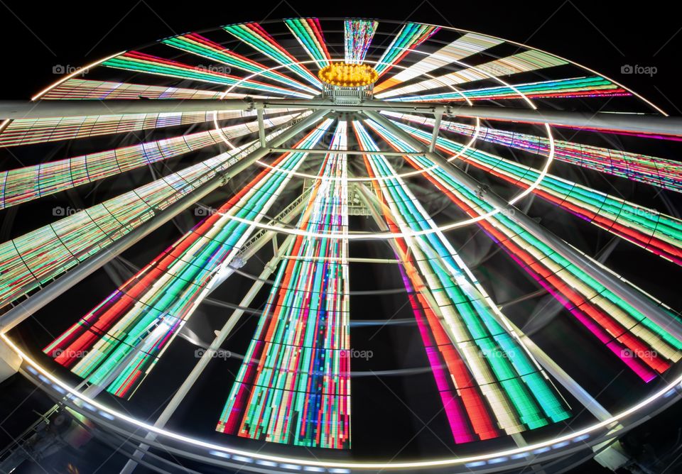 Light of Ferris wheel while movement show colorful on black background 