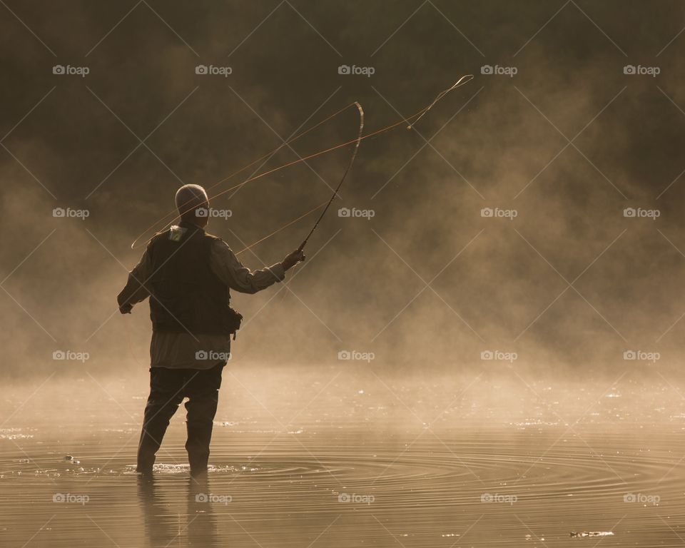 Fly Fisherman on an Early Foggy Morning