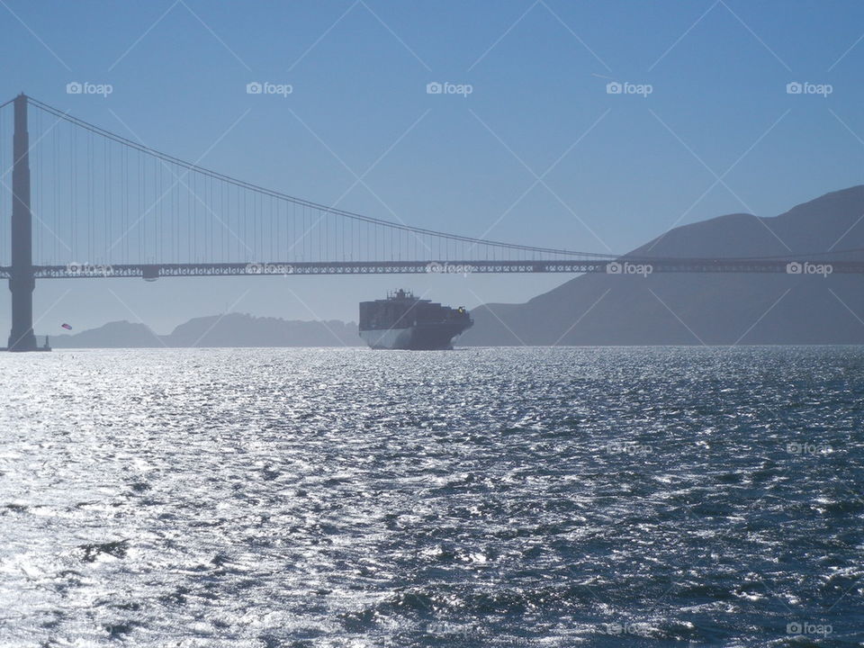 golden gate bridge and a ship from the bay