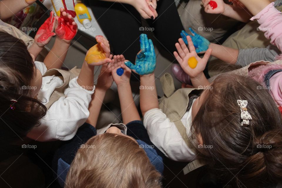 children's hands in paint