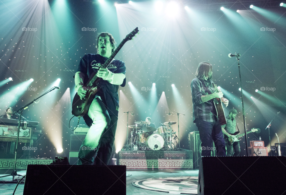 members of the christian rock band third day perform on stage. on stage. by arizphotog
