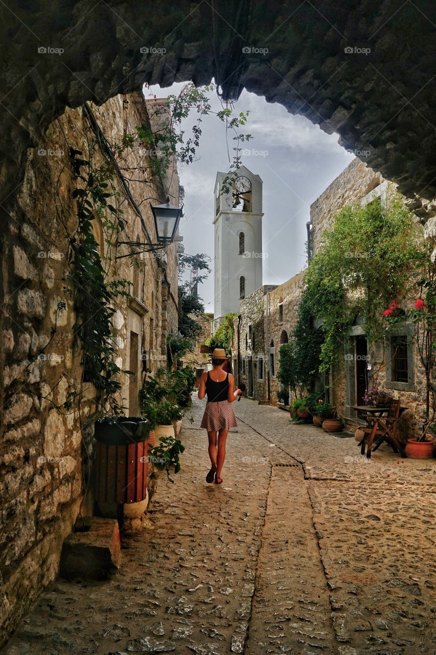 Beautiful woman is walking alone in Chios Island