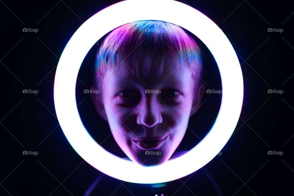 boy's face in glowing circle