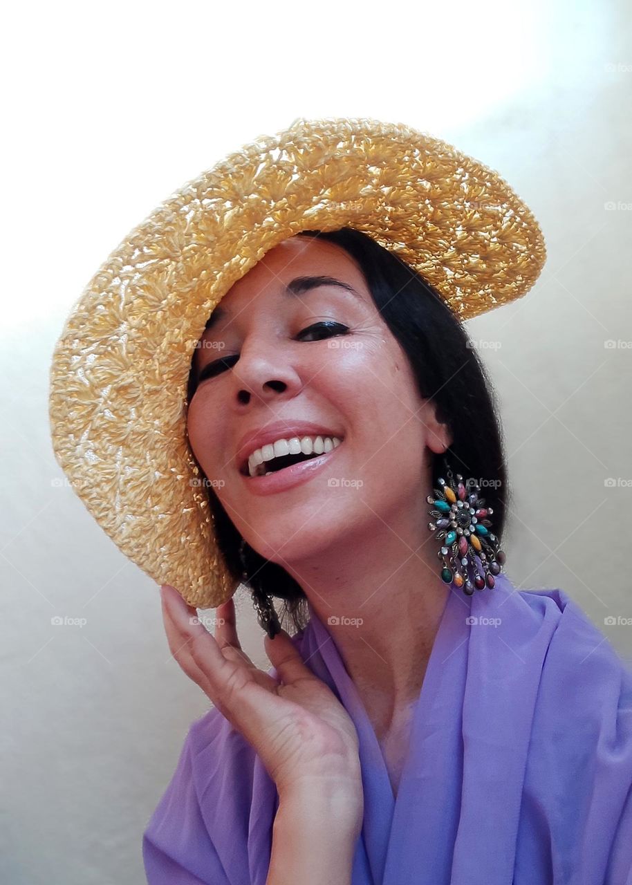 Portrait of Beautiful Smiling Woman with Yellow Hat