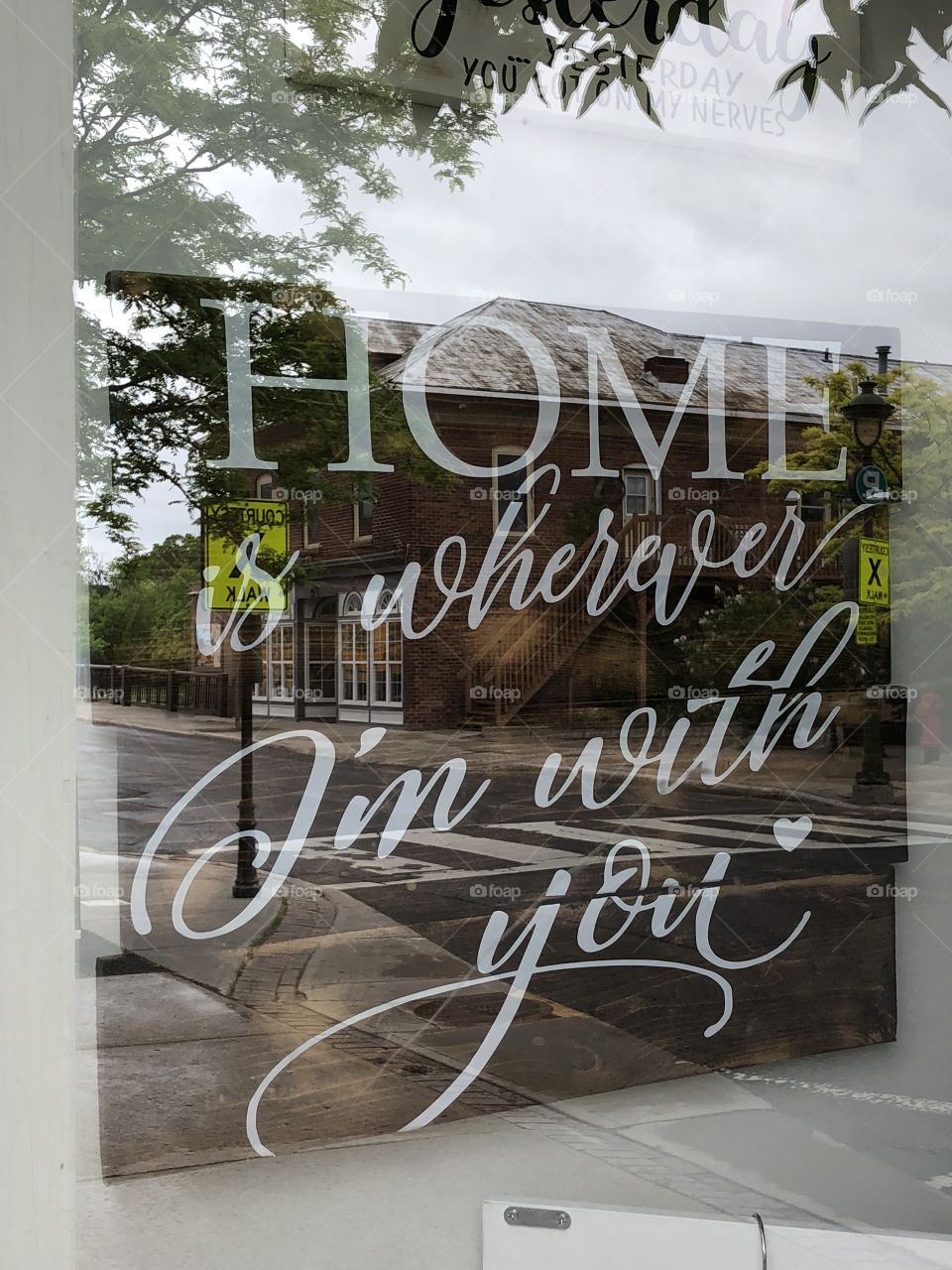 Window frame quote with building reflections 