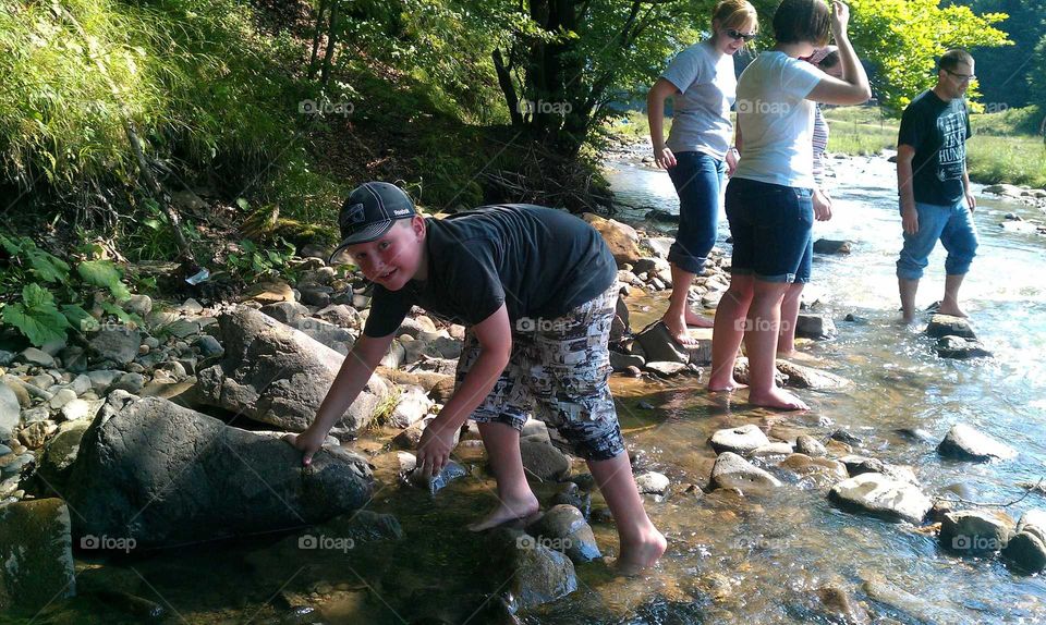 Cooling off in a Romanian stream during a mission trip
