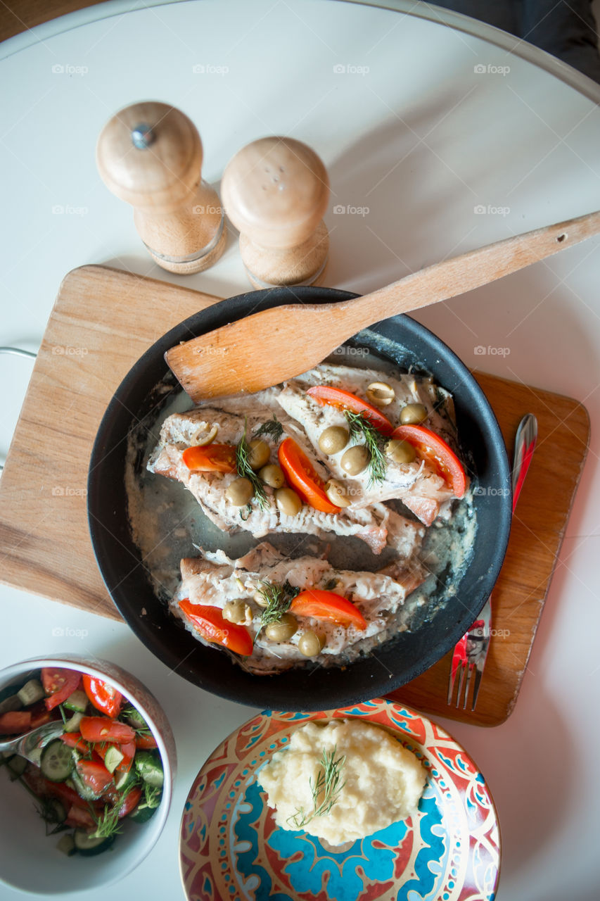 Dish with Sea bass fried with vegetables 