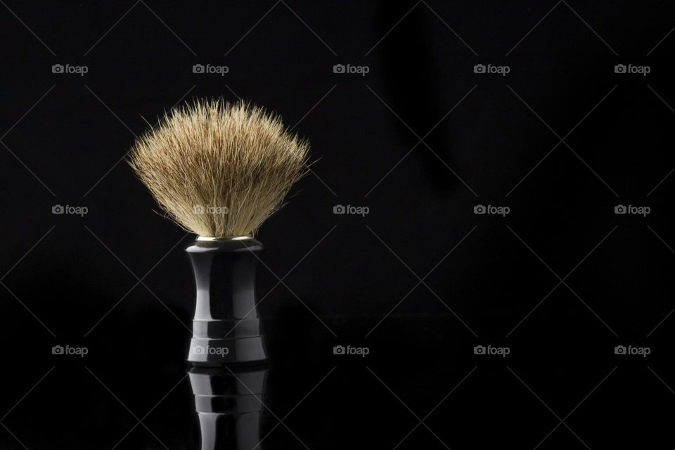 shaving brush on black,  copy space