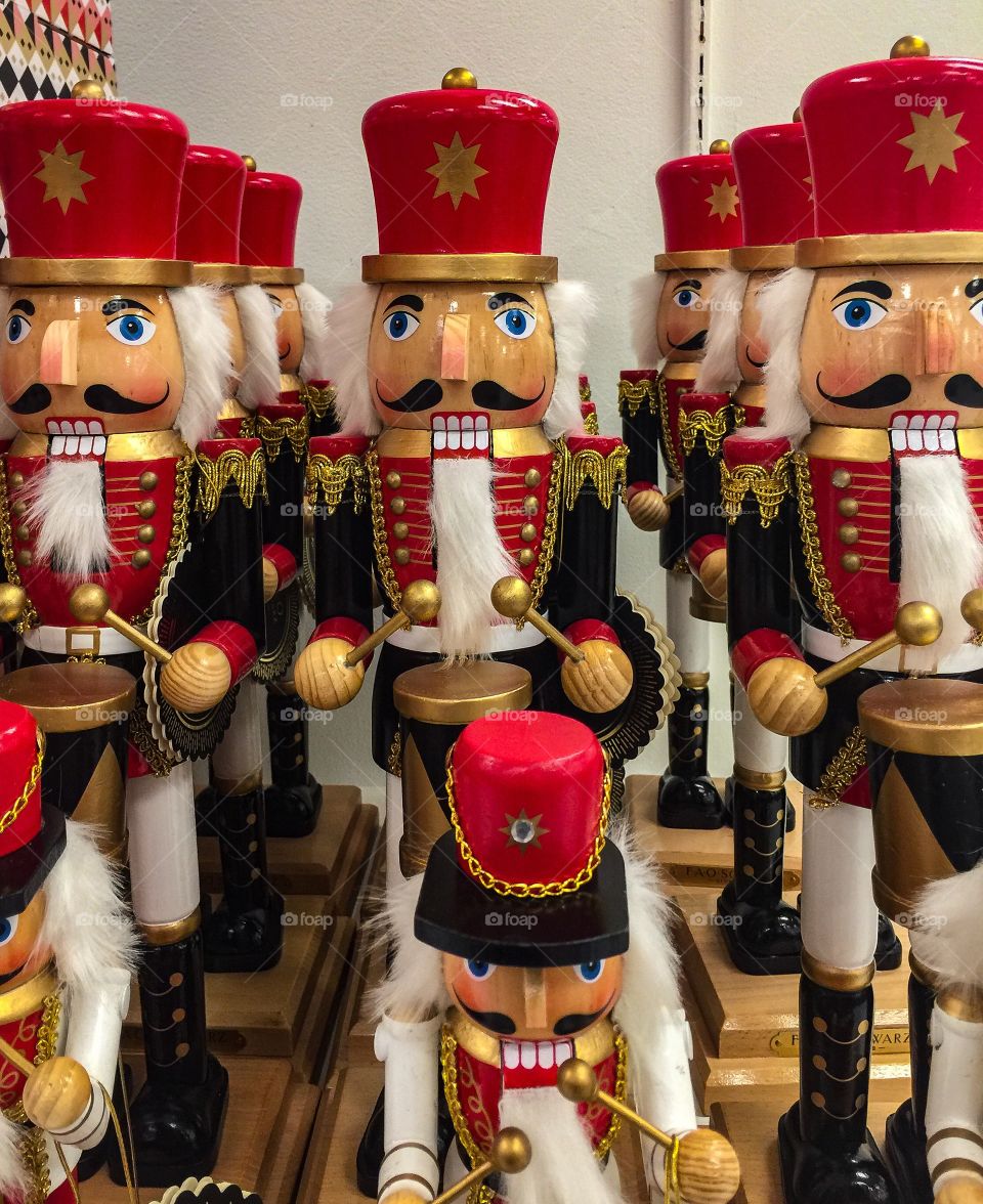 Red wooden nutcrackers all lined up for sale