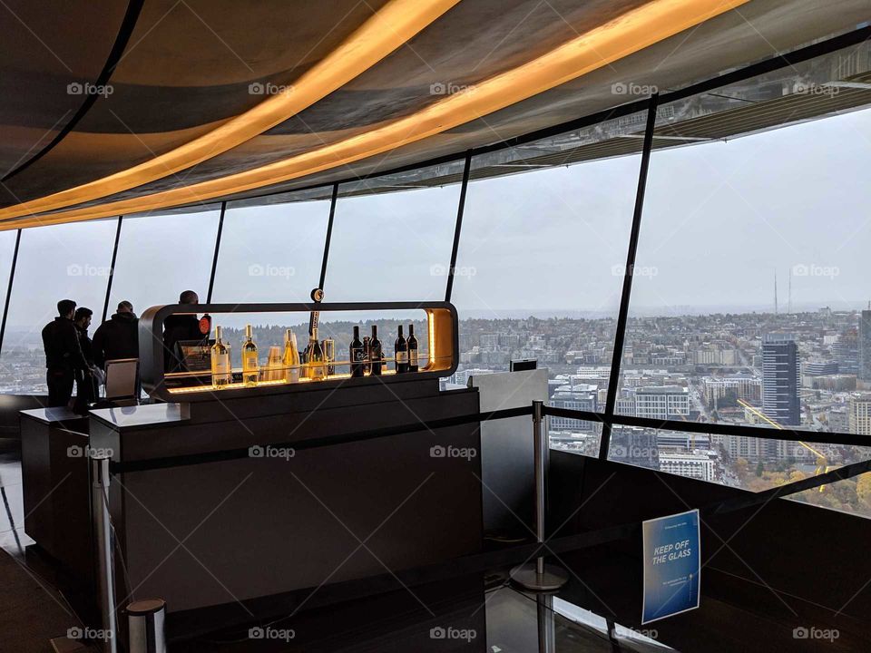 view of bar and city of Seattle from interior of Space Needle viewing platform