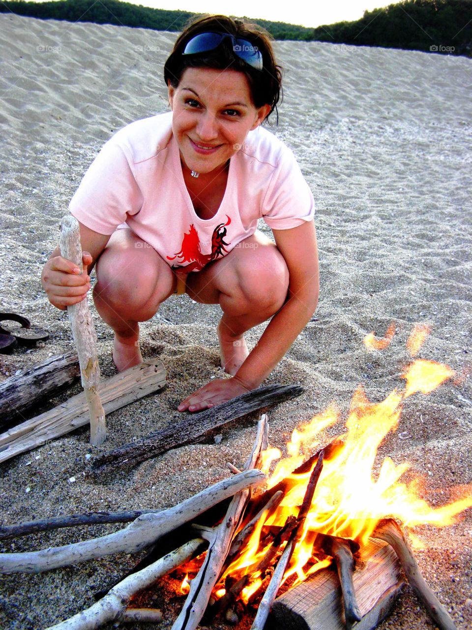 A campfire on the sand beach