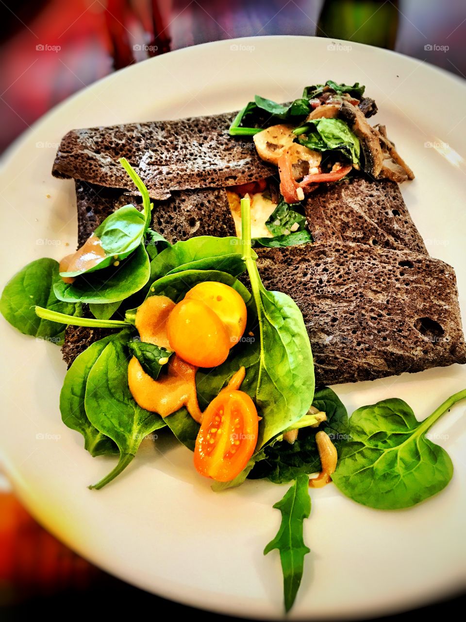 Buckwheat crepé with chicken spinach and tomatos 