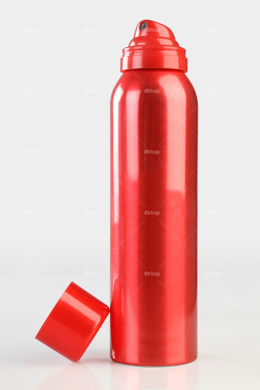 Red colored metallic deodorant spray can