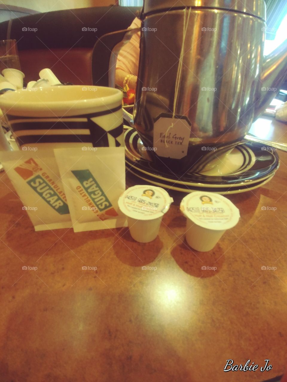 Time for tea two packets of sugar and two cream and two Earl Grey tea bags