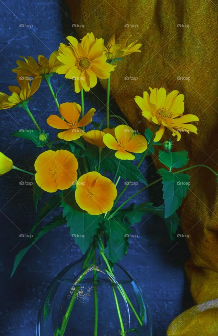 pot in nice colour flower like yellow orange arrange properly pot and flowers looks nice