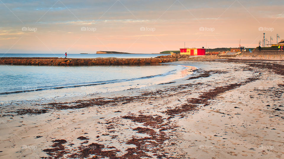 Red neach house on Salthill beach in Galway city, Ireland