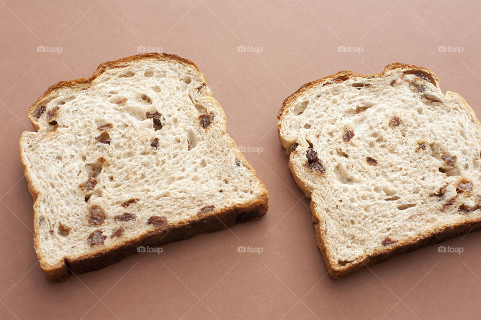 Two slices of bread next to each other