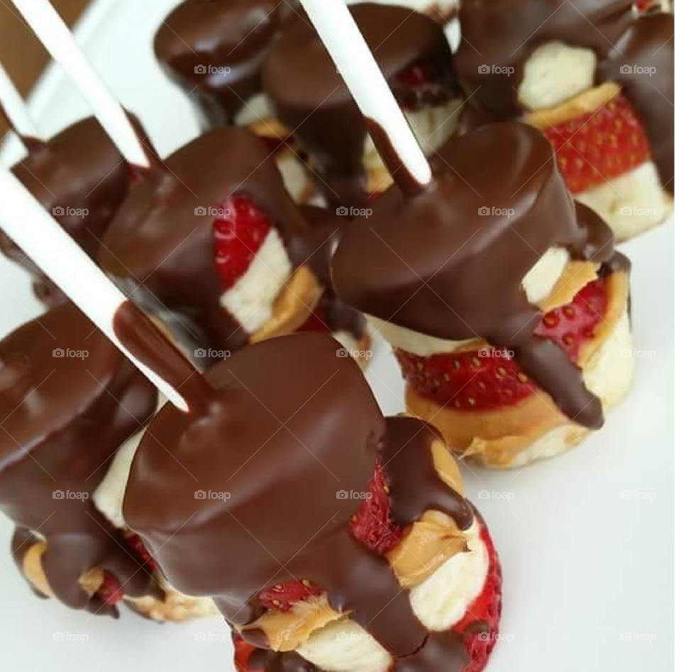 Chocolate covered strawberry and banana cake pops.