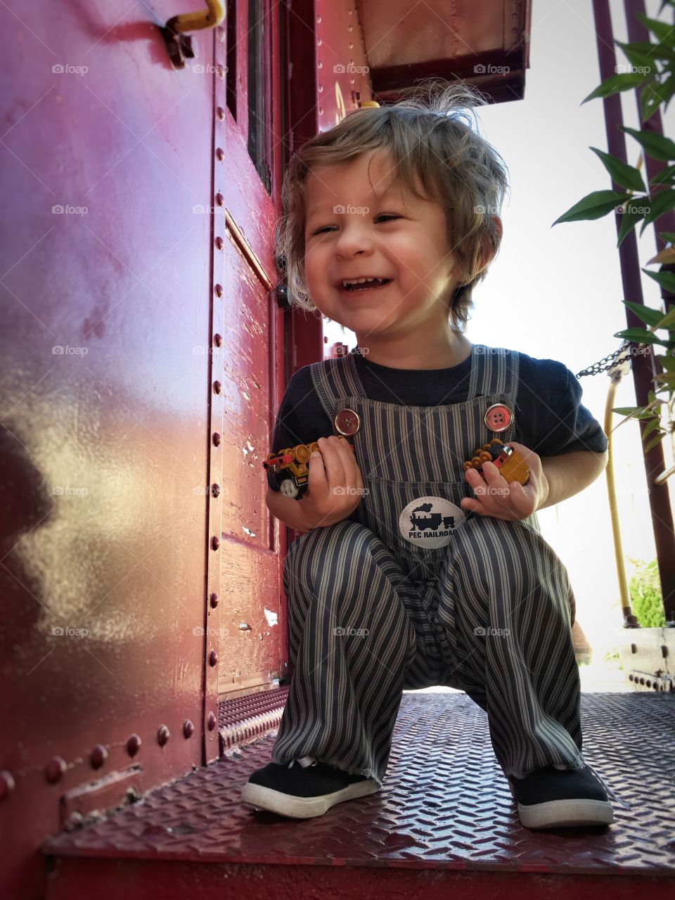 Smiling boy holding toy