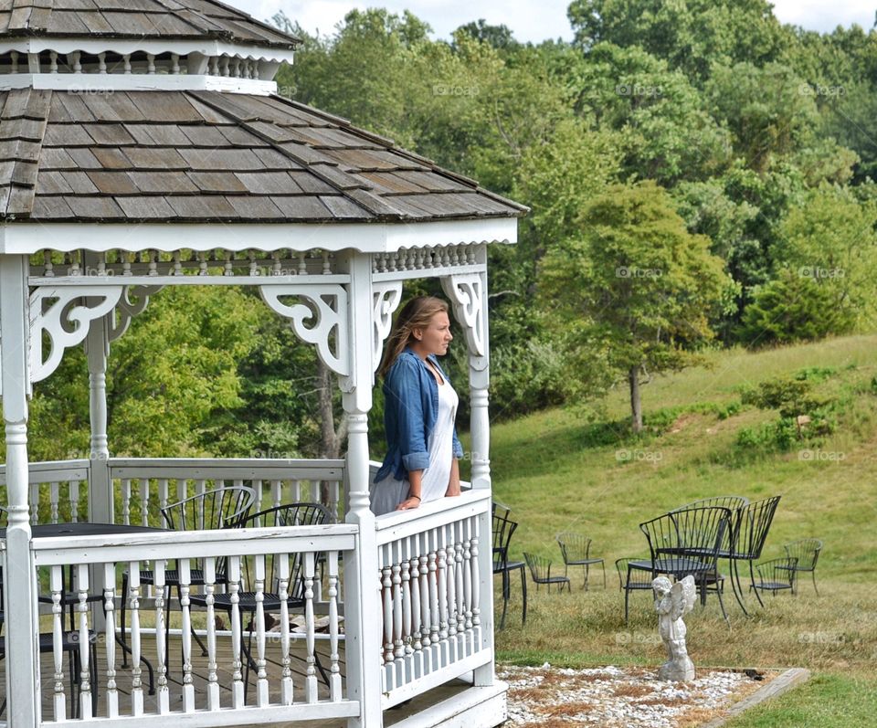 Beautiful girl in a gazebo