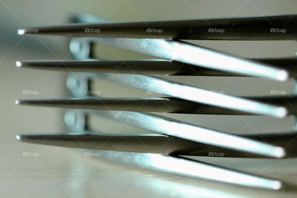 Close-up of two intertwined forks