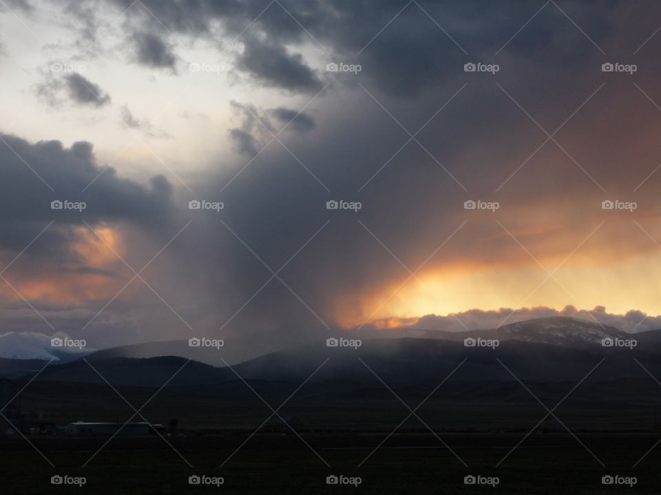 storm over the mountains on a summer or spring night at sunset.