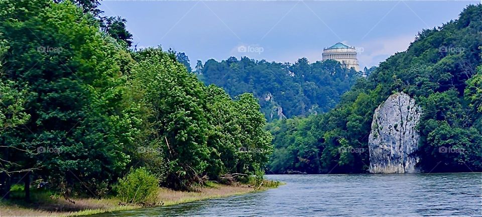 On a mountaintop to the right we see the Greco-Roman classical structure of “Befreiungshalle” or “Liberation Hall” by “Kelheim”, Bavaria built by King “Ludwig I” to celebrate Germany’s victory over “Napoleon” in 1815. 2024. Hypnotic Productions