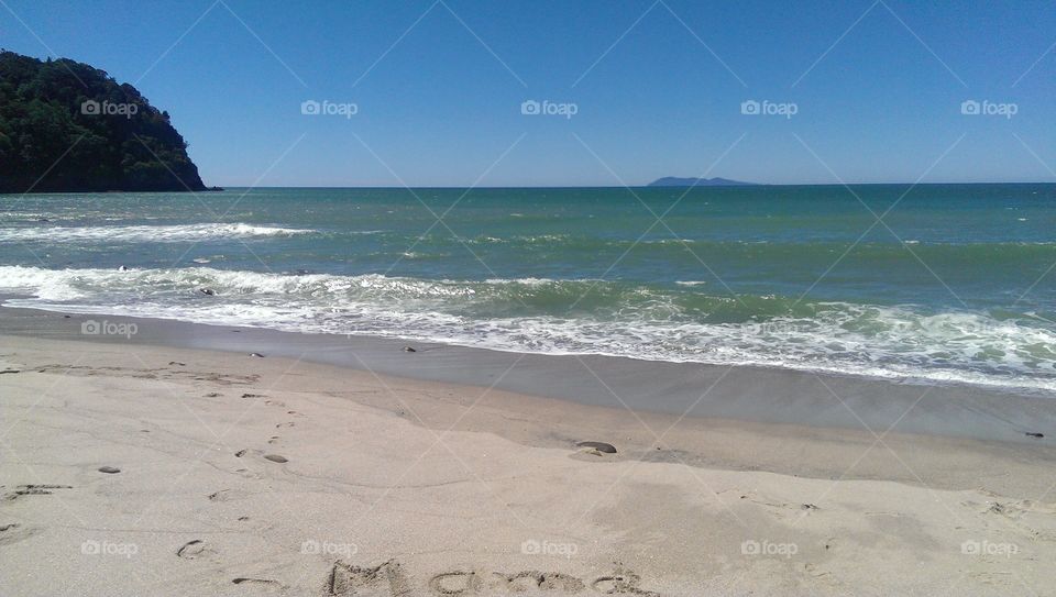View of text on sand at seashore