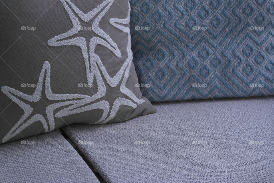 Beige star print and blue cushions